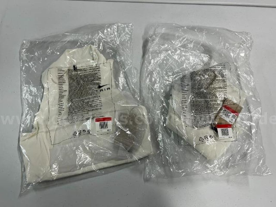 Lot of 2, Nike Air Dri-Fit Swoosh Mock Zip Sports Bra.White in color.Size:L
