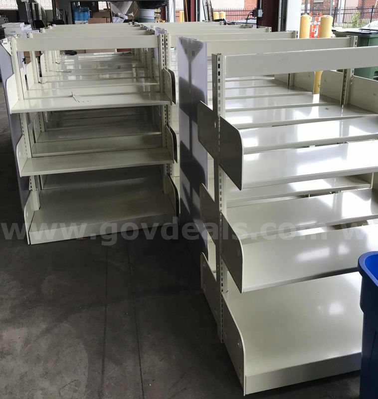 12 used library shelving units. (S2)