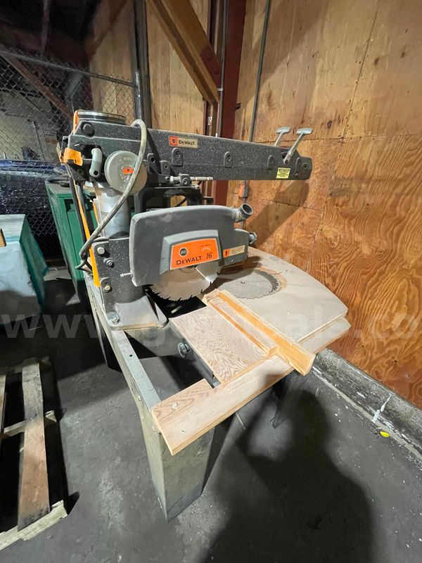 Dewalt 16-inch Radial Arm saw mounted on stand table