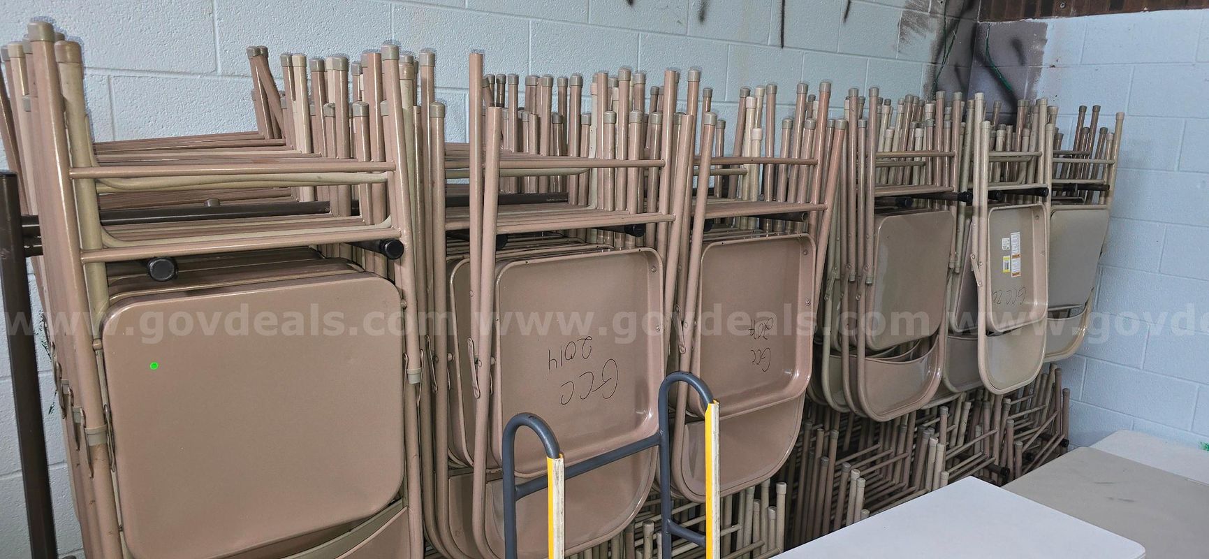 Lot of folding chairs and racks