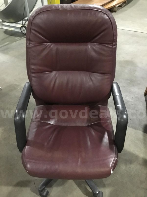 Dark burgundy leather chair; with black padded armrests "DH"
