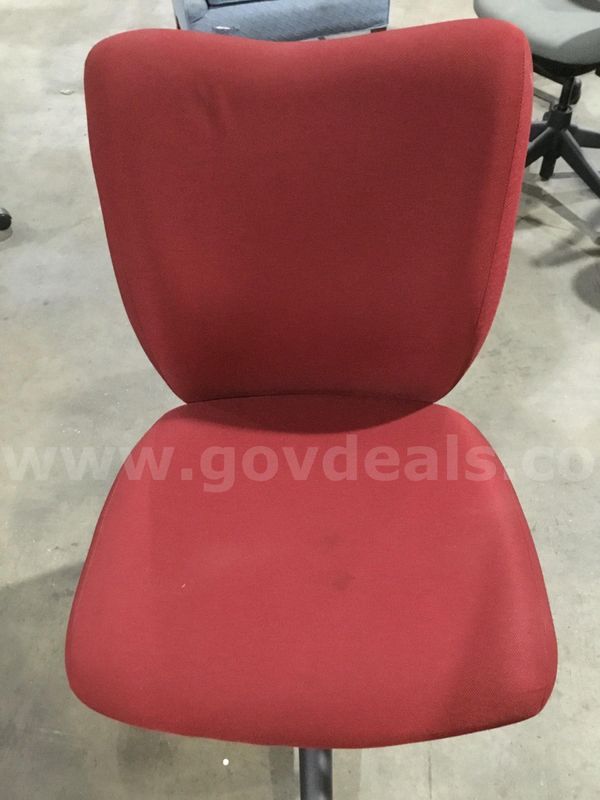 Dark red armless chair; with a black backboard "DH"