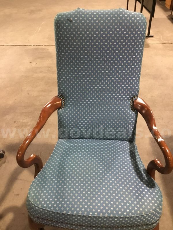 Blue executive chair; with dark brown wood armrests "DH"