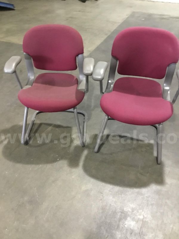 2 burgundy chairs; with gray padded armrests "DH"