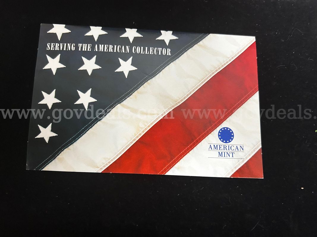 The American Mint Collection – Two (2) Gold‑Tone Commemorative Coins
