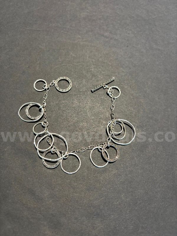 TiDDRs: Beautiful 7" Toggle Bracelet. Looks like silver. No Magnetism. No stamp.