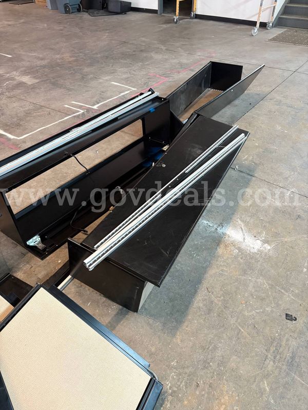 Black overhead cabinets with pinboards