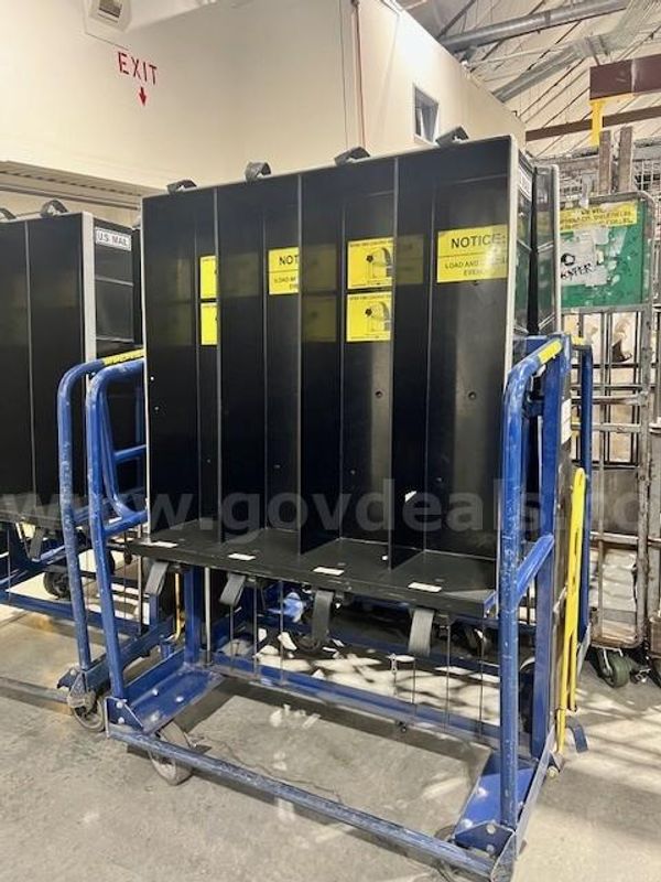 Industrial Equipment: Spinner racks - (Lot of 128), and 2 ERGO Carts.