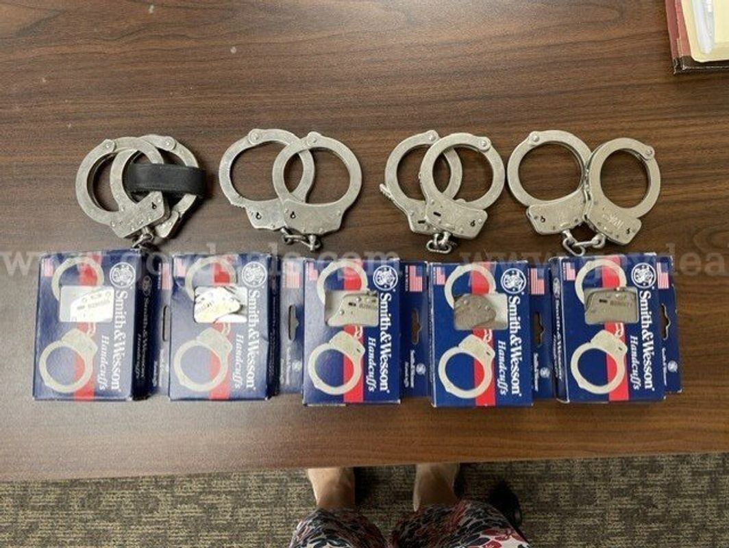 Handcuffs and Cases - Lot of 9 (5 New Smith & Wesson / 4 Used Various Brands) and 2 cuff cases