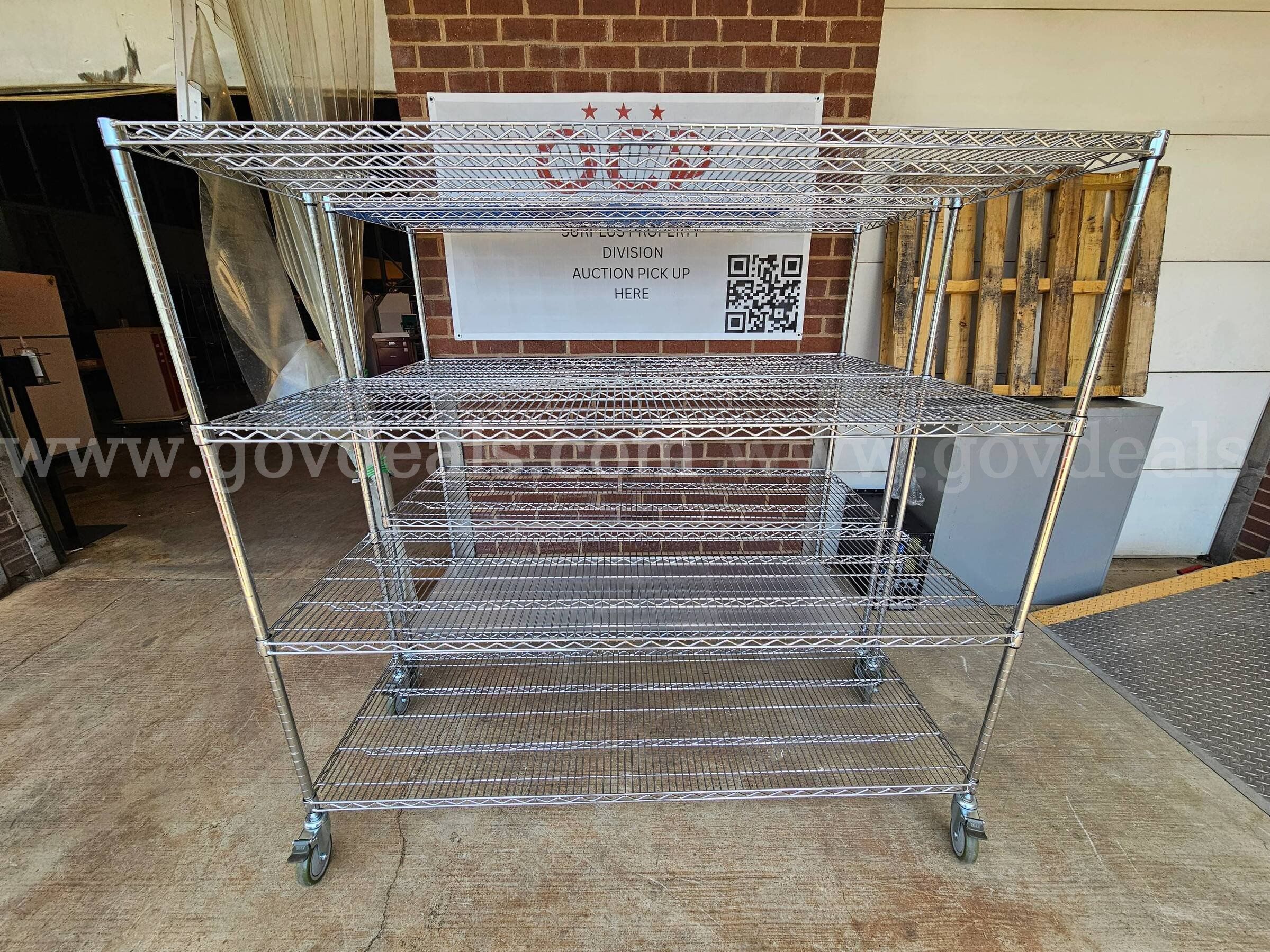 Lot of 2- Metal racks on wheels -  61.5" H  X  71" W