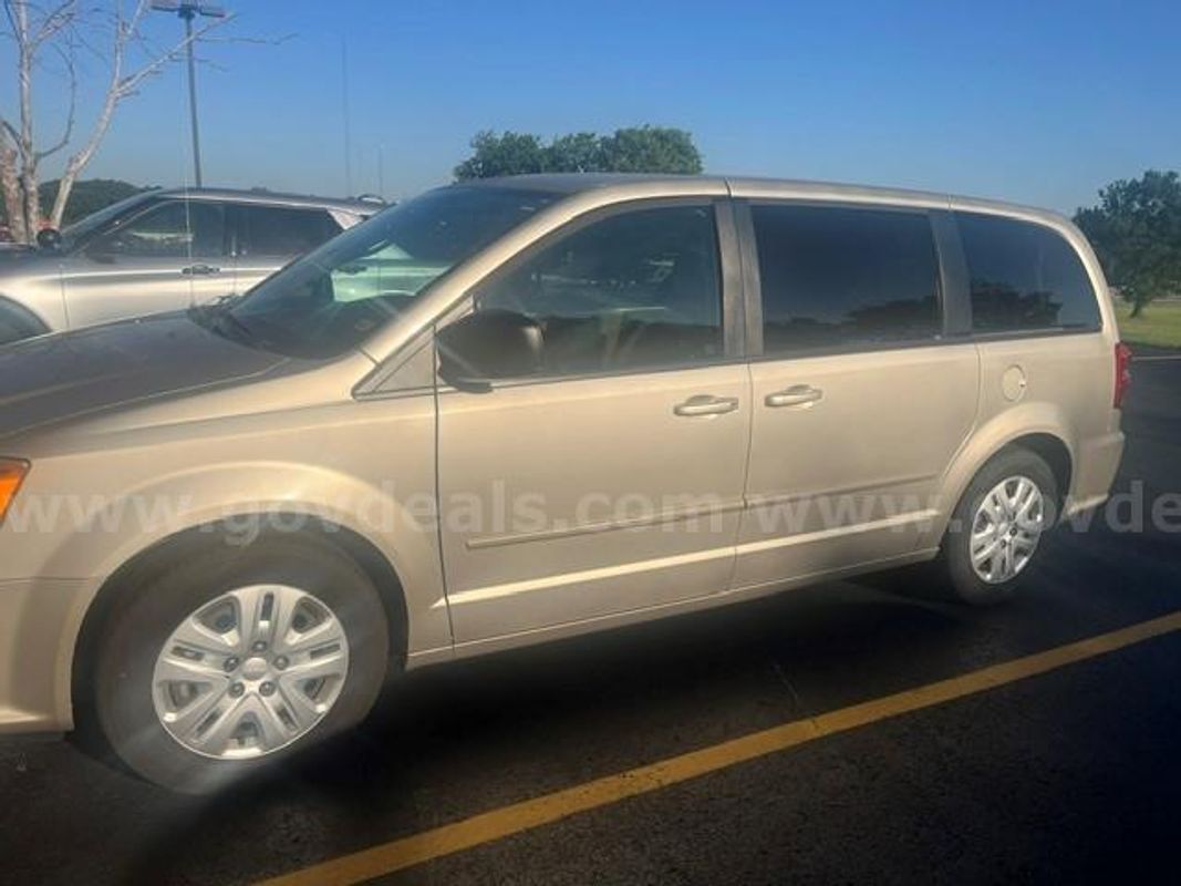 2014 Dodge Grand Caravan; 174,750 Miles.