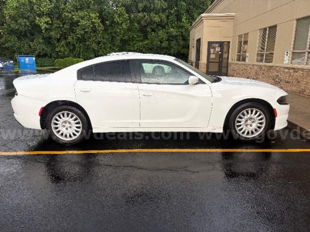 2020 Dodge Charger; 135,836 Miles.