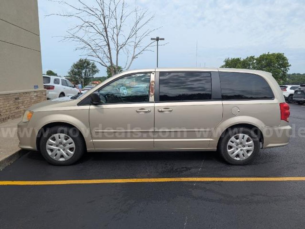 2014 Dodge Grand Caravan; 172,358 Miles.