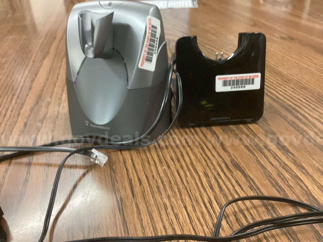 A lot of two (2) MISMATCHED charging bases of Plantronics wireless headsets – the headsets are missing