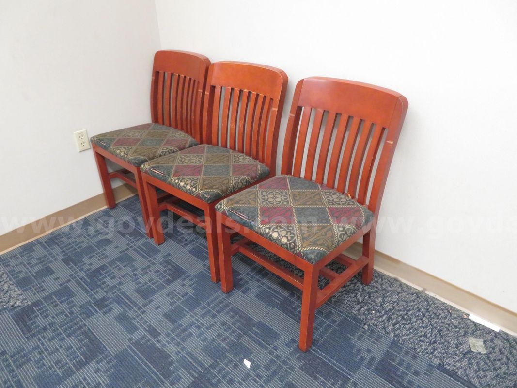 Set of 3 Wooden chairs with floral fabric.
