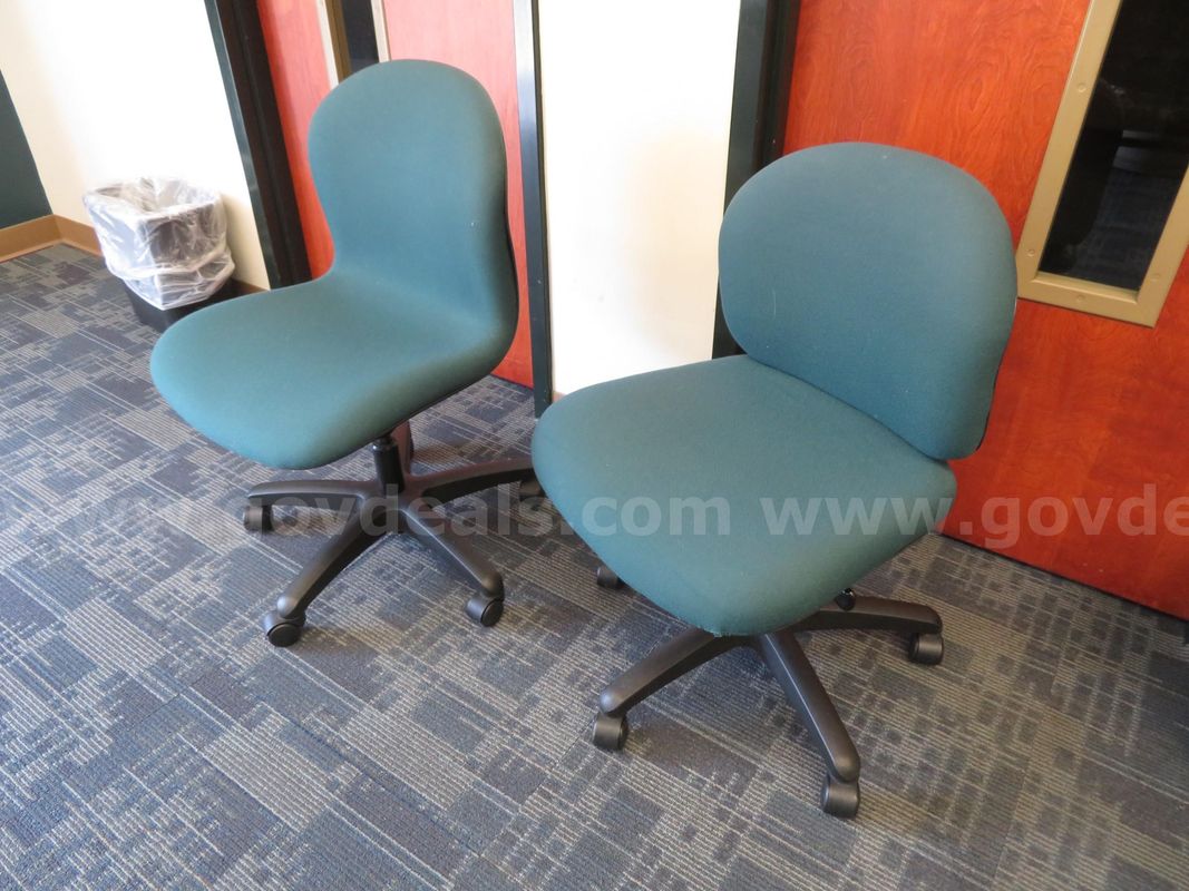 Set of 7 green/teal rolling chairs