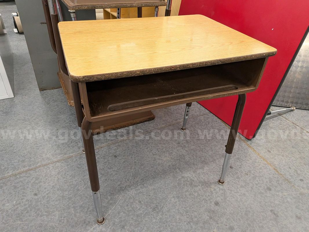 4 elementary desks with plastic cubby and wood top