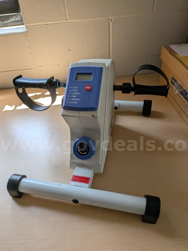 Indoor sitting pedal exerciser