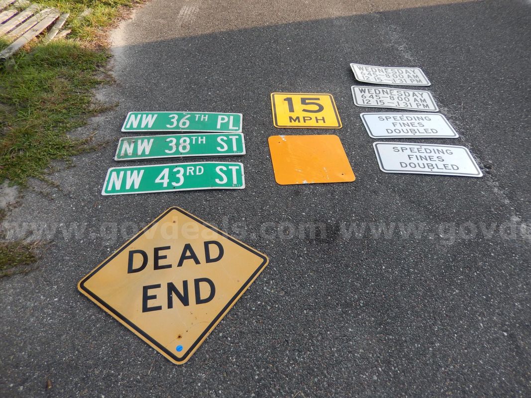 USED (3) STREET SIGNS, (1) DEAD END SIGN, (1) 15 MPH SIGN, (2) SPEEDING FINES DOUBLED SIGNS, (1) YELLOW REFLECTIVE SIGN