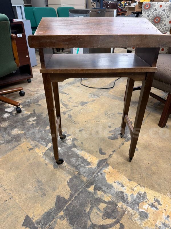 Brown podium table with wheels