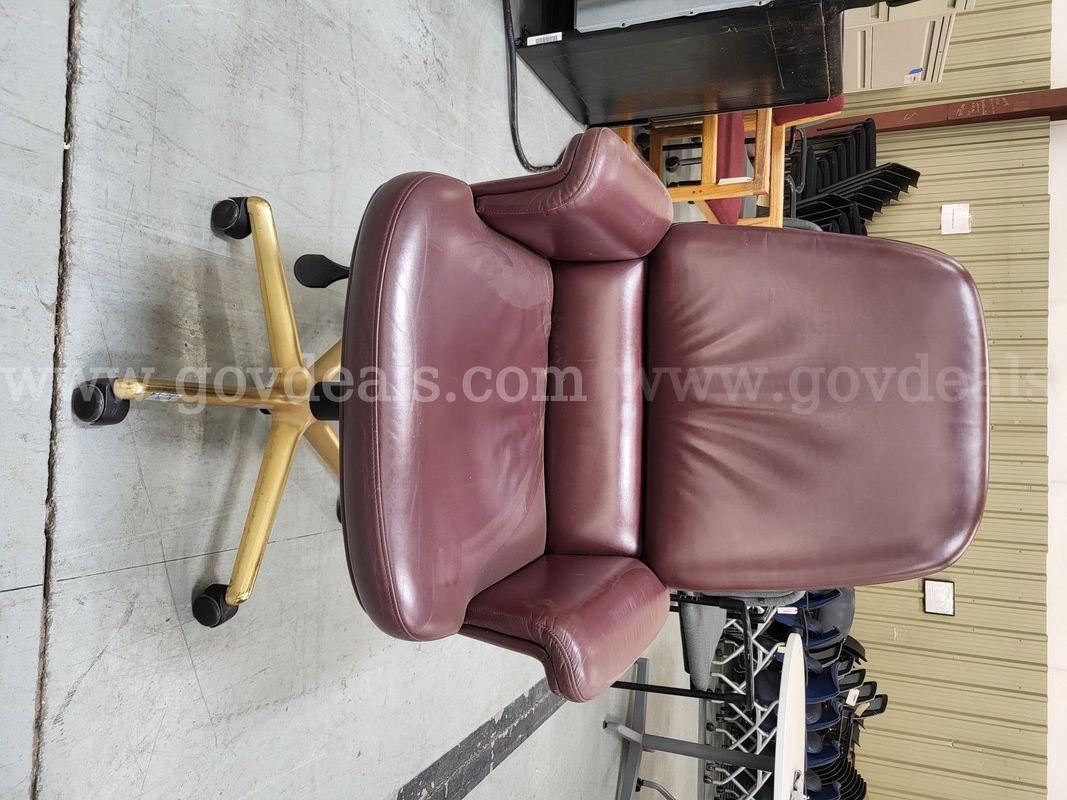 Red leather chair with NM State seal